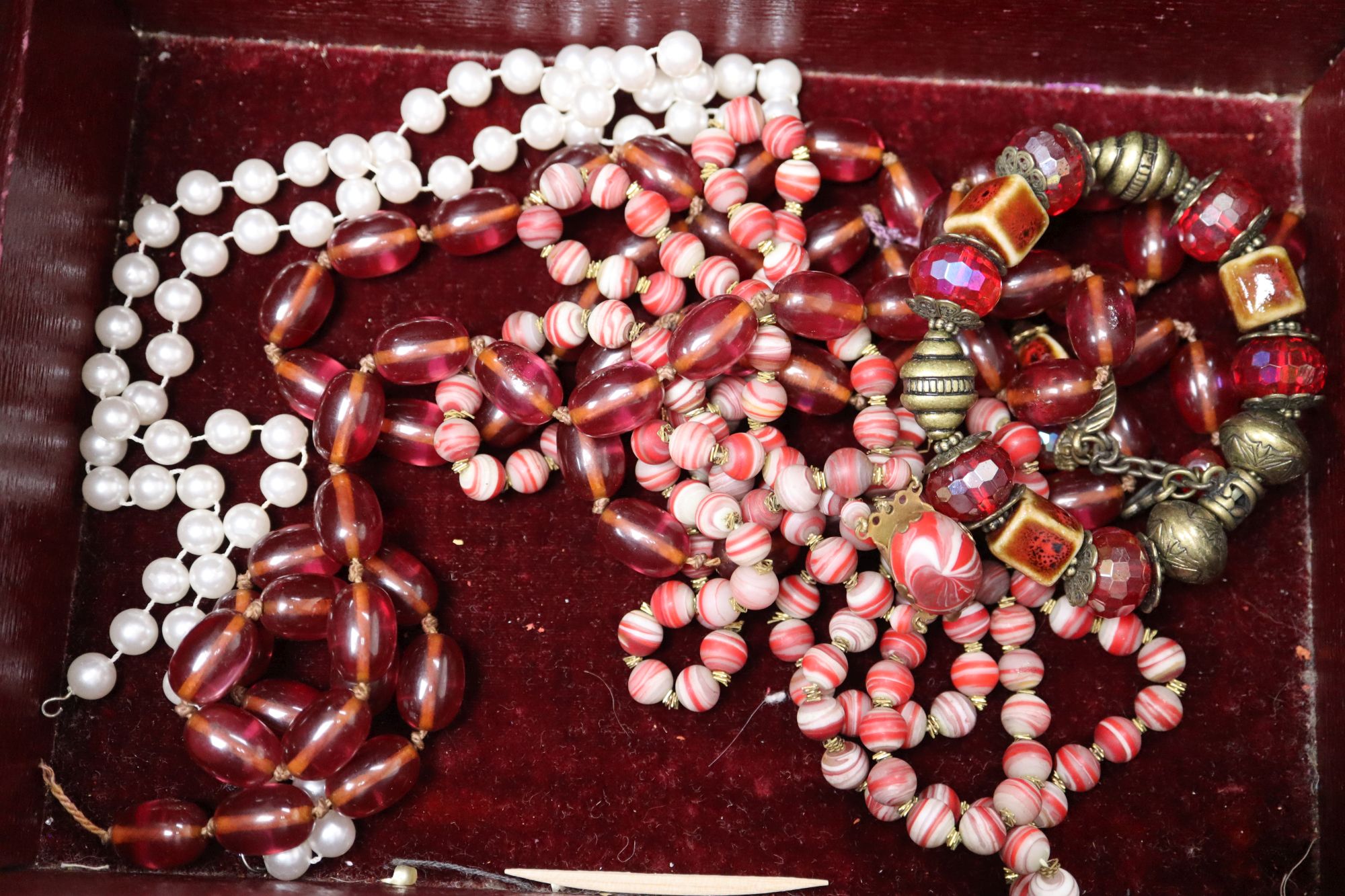 A box of assorted costume jewellery.